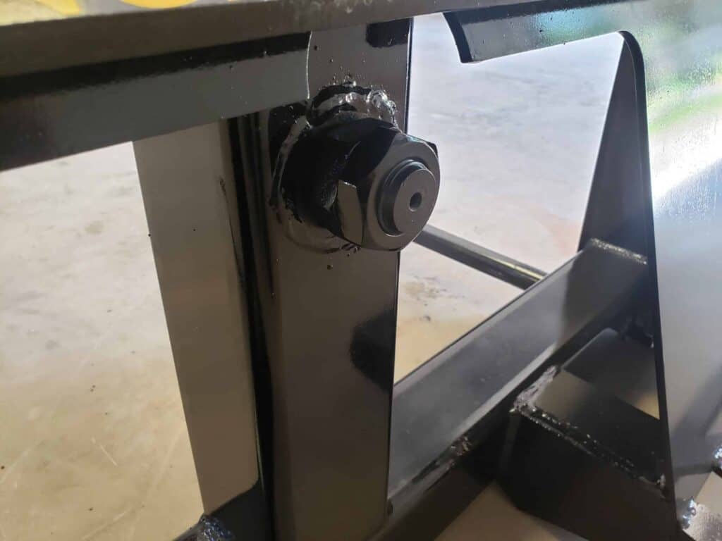 Close up of Stinger BS1 skid steer bale spear mounting frame and reinforced spear holder