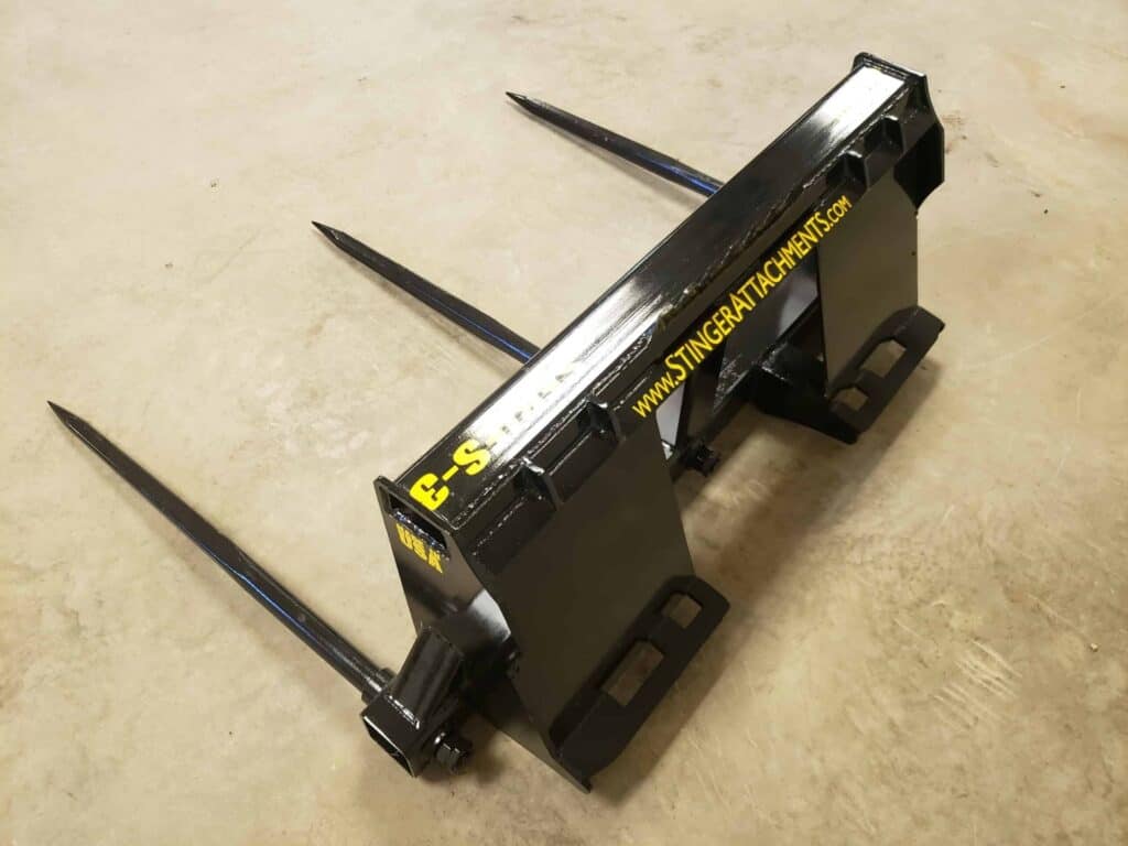 Stinger BS3 skid steer bale spear attachment angled view showing bale spikes