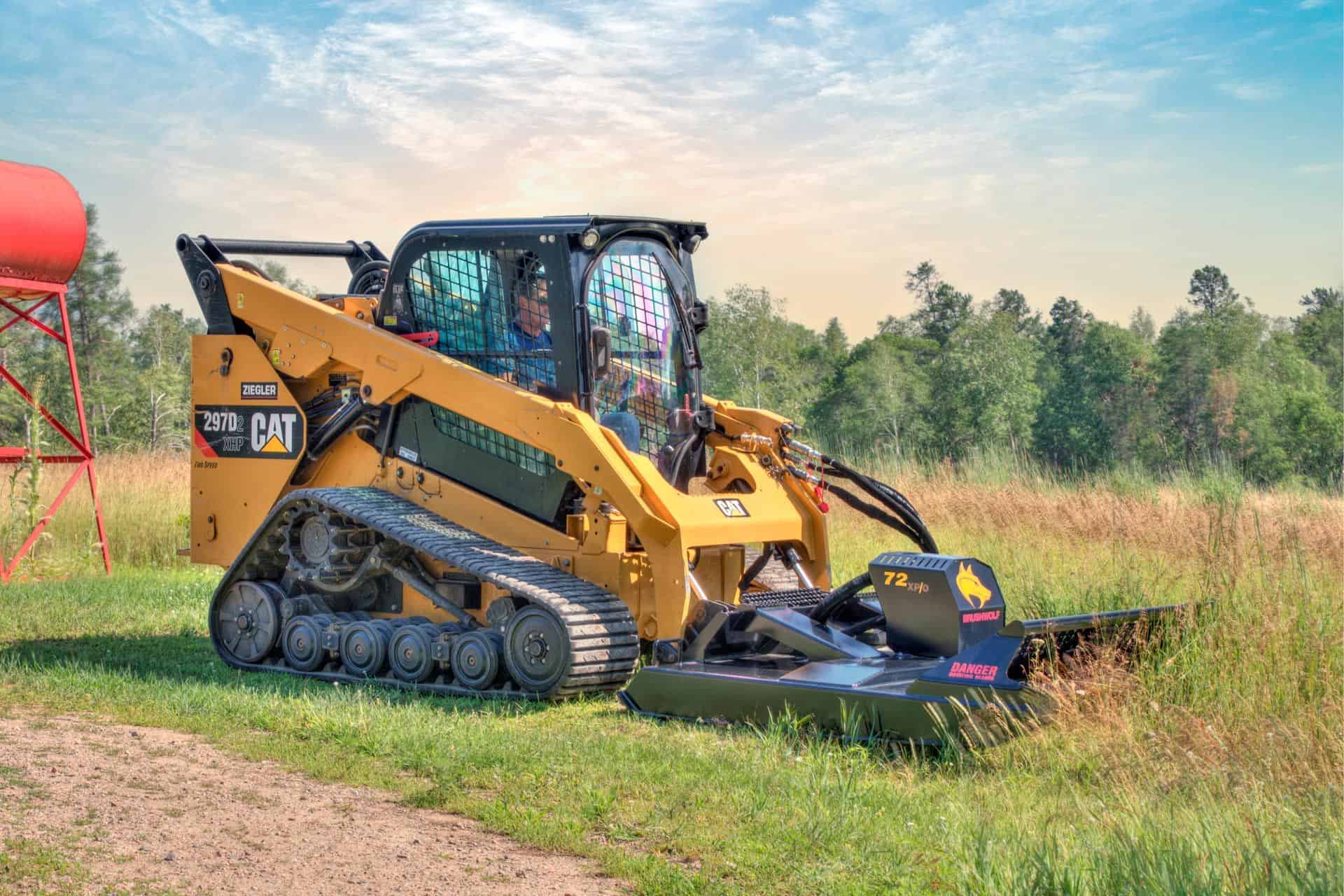 Skid steer operating Brush Wolf extreme duty brush cutter mowing dense grass and vegetation