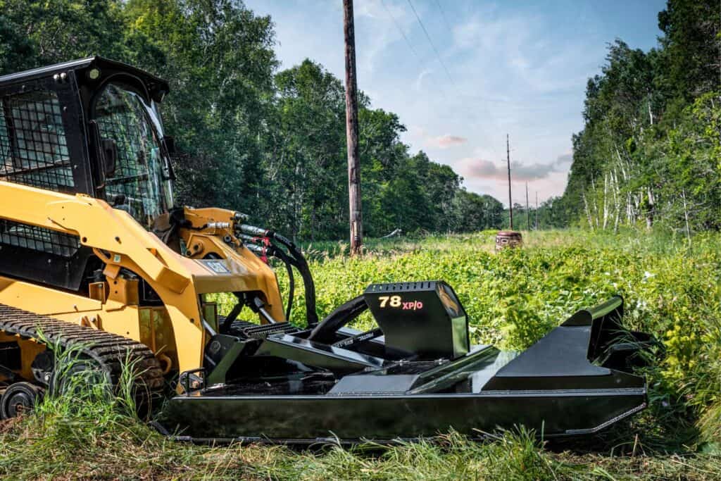 Brush Wolf 78 XPO open front extreme duty skid steer brush cutter clearing heavy grass and brush in field conditions