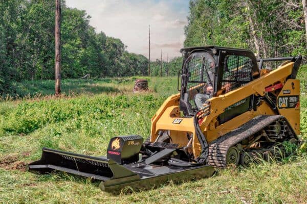 Compact track loader operating Brush Wolf extreme duty brush cutter attachment clearing thick brush