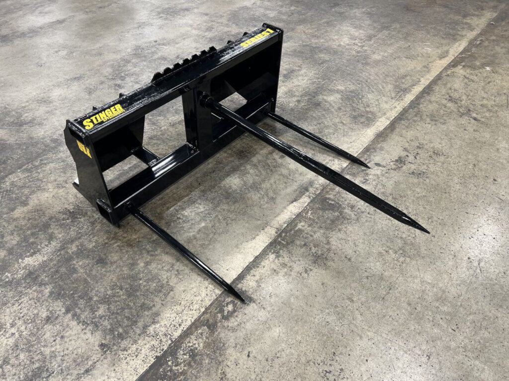 Stinger BSS skid steer bale spear attachment for lifting, stacking and transporting round hay bales on farms and ranches