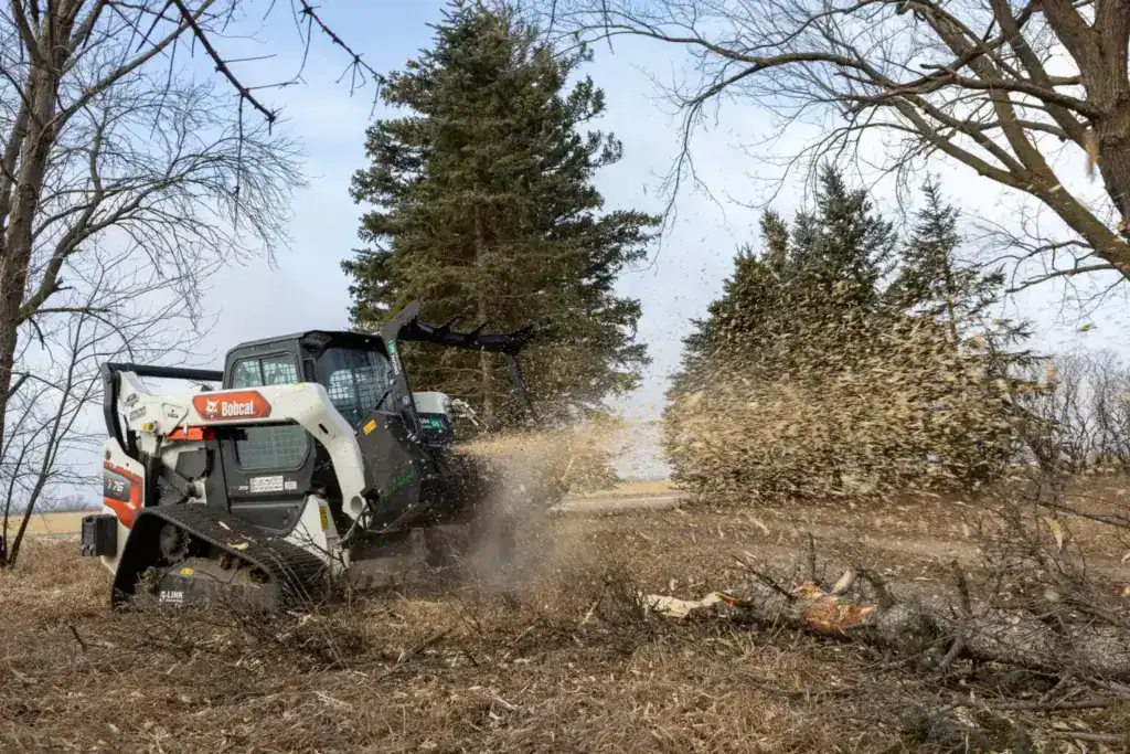 Diamond Mowers DC Pro drum mulcher cutting fallen tree showing efficient debris processing and clearing
