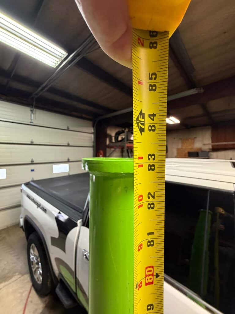ECHO pneumatic jack minimum height measurement showing compact collapsed height for easy placement under equipment