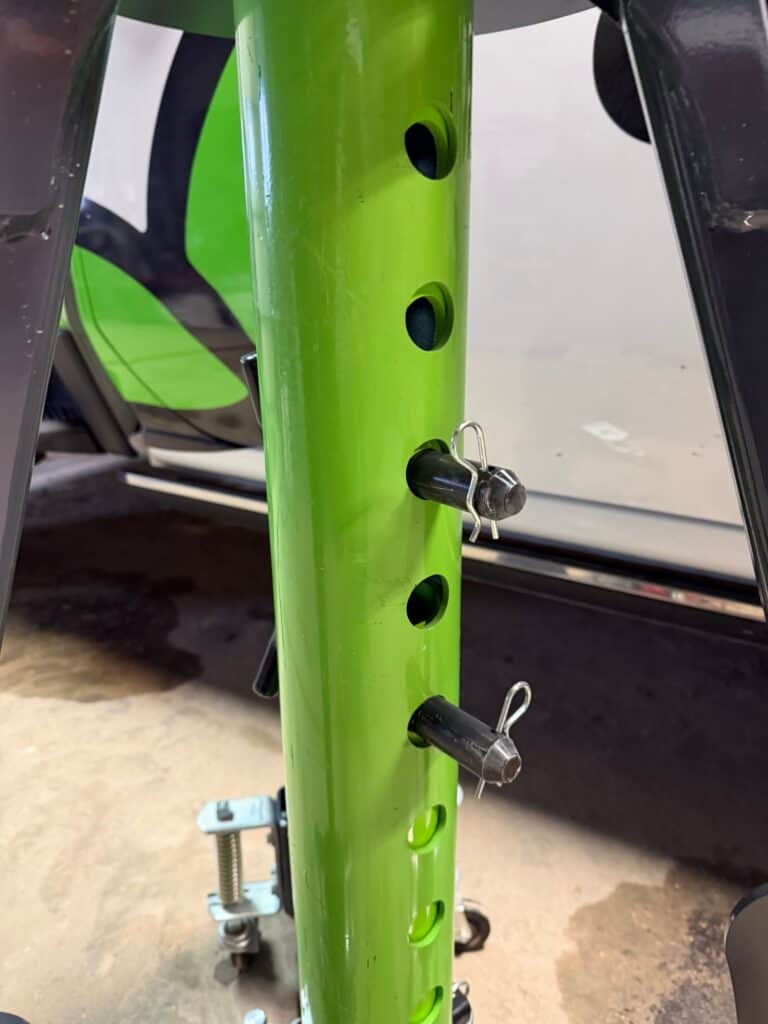 ECHO pneumatic jack inner post with adjustment holes showing multiple height positions for precise lift control