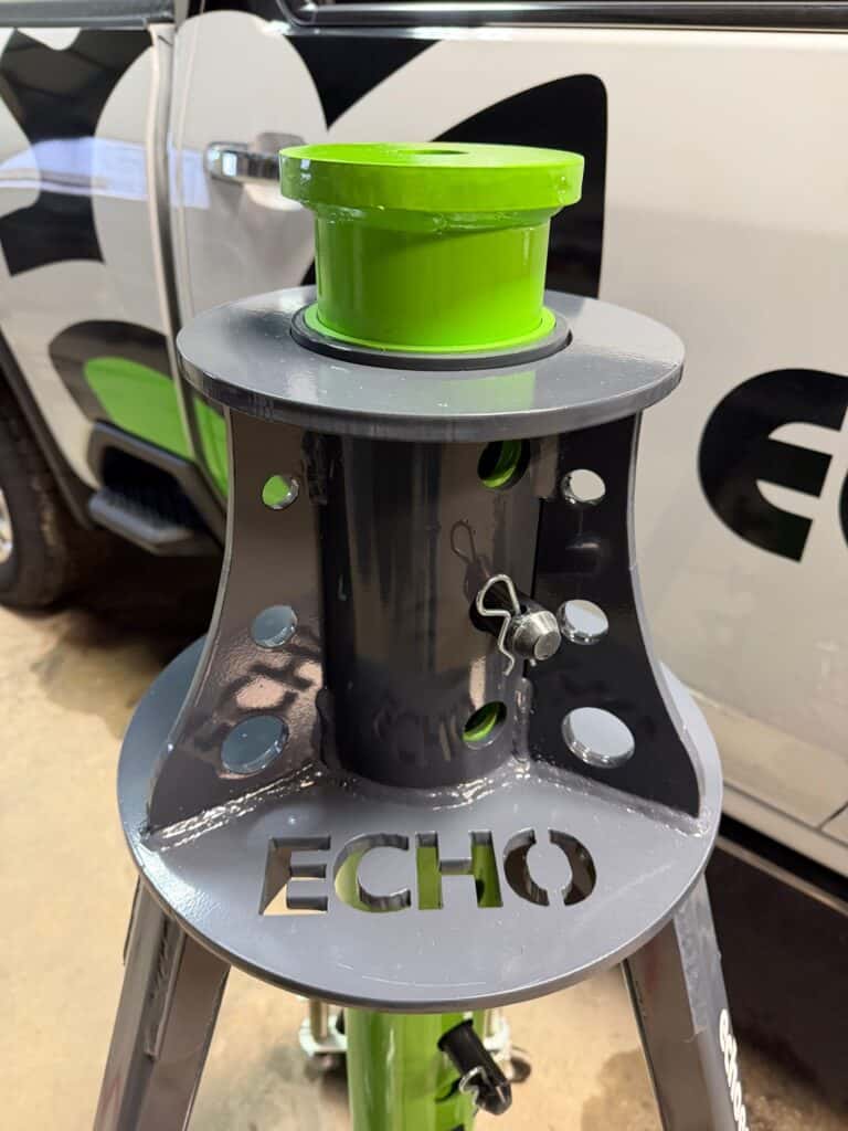 ECHO pneumatic jack top plate and pin system close up showing adjustable height settings for agricultural equipment lifting