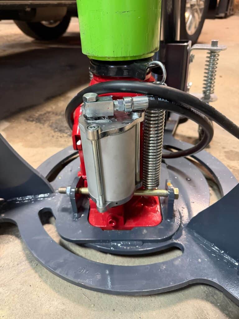 ECHO pneumatic jack regulator and base close up showing heavy duty construction and air system components