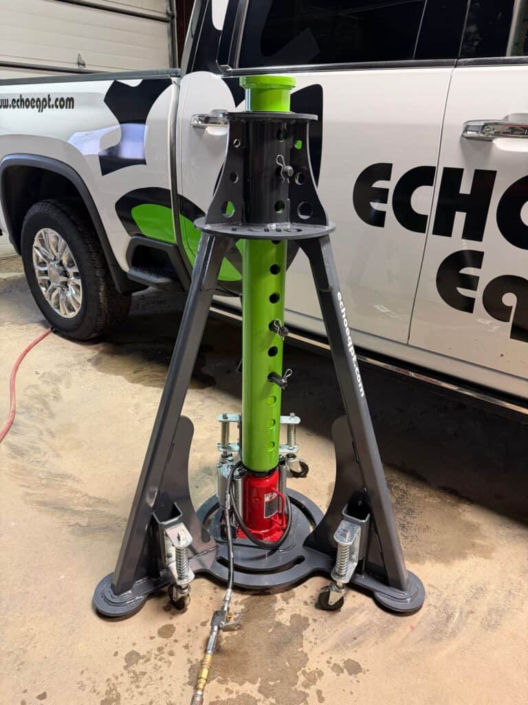 ECHO pneumatic jack side view showing support frame and structure for stable lifting during service work