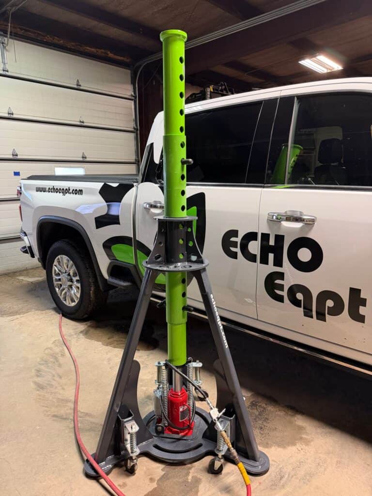 ECHO 20 ton pneumatic agricultural jack side view mounted near truck showing heavy duty sprayer lifting support
