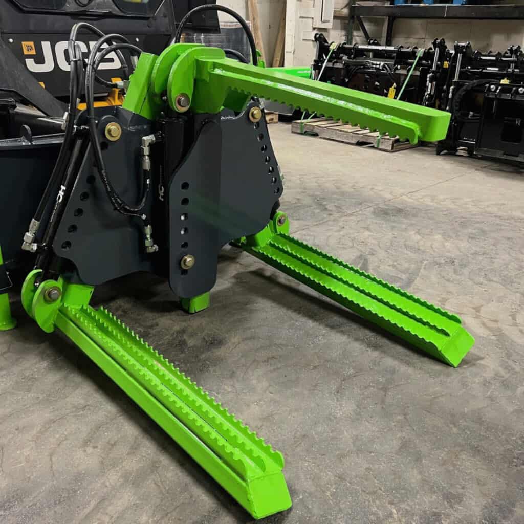ECHO X3I industrial skid steer tire handler front view showing dual arm structure, hydraulic system, and secure tire handling