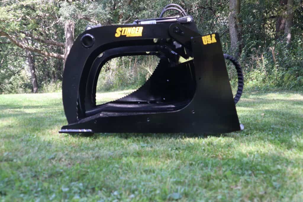 Stinger ROG skid steer rock grapple attachment designed for handling rocks, brush and debris during land clearing