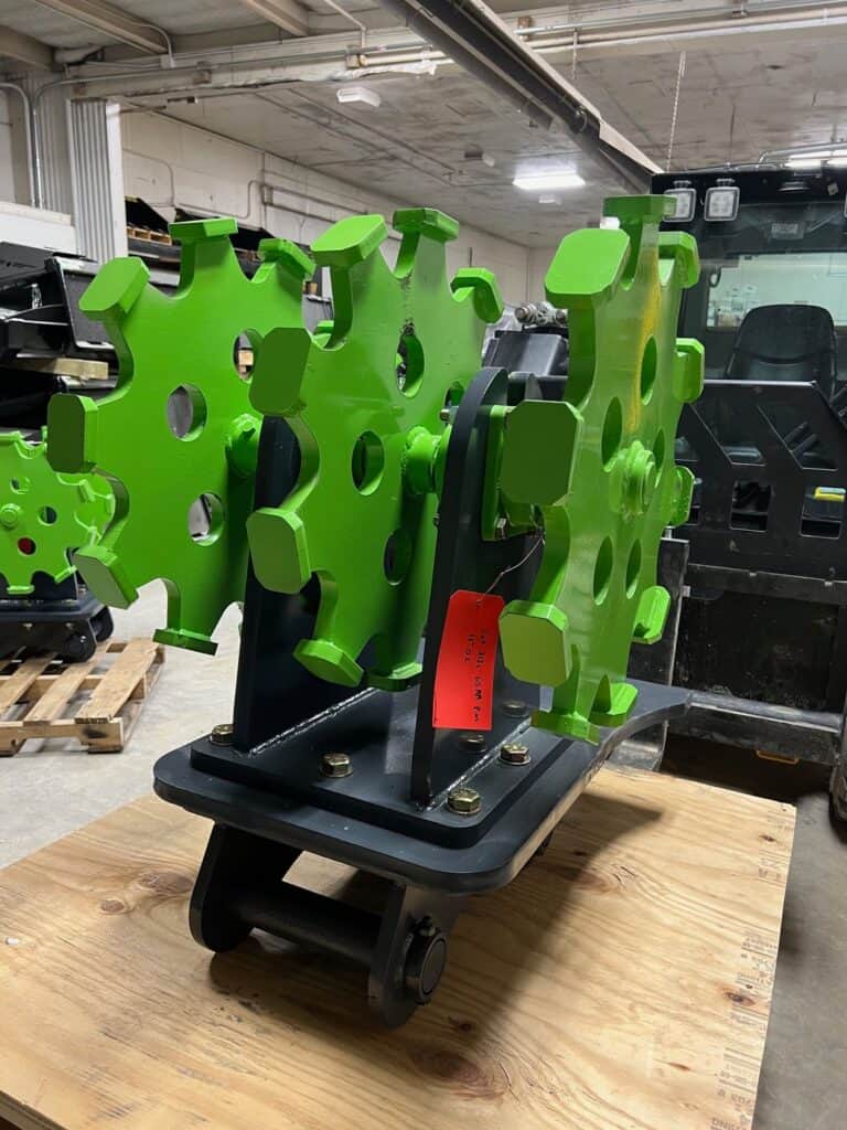 Excavator compaction wheel attachment for pipeline, drainage, and utility trench compaction