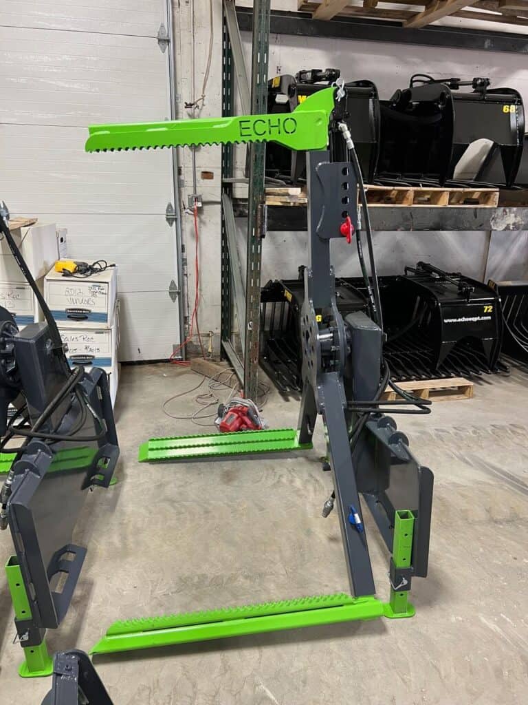ECHO OG skid steer tire handler attachment with green boom arm mounted on lifting frame