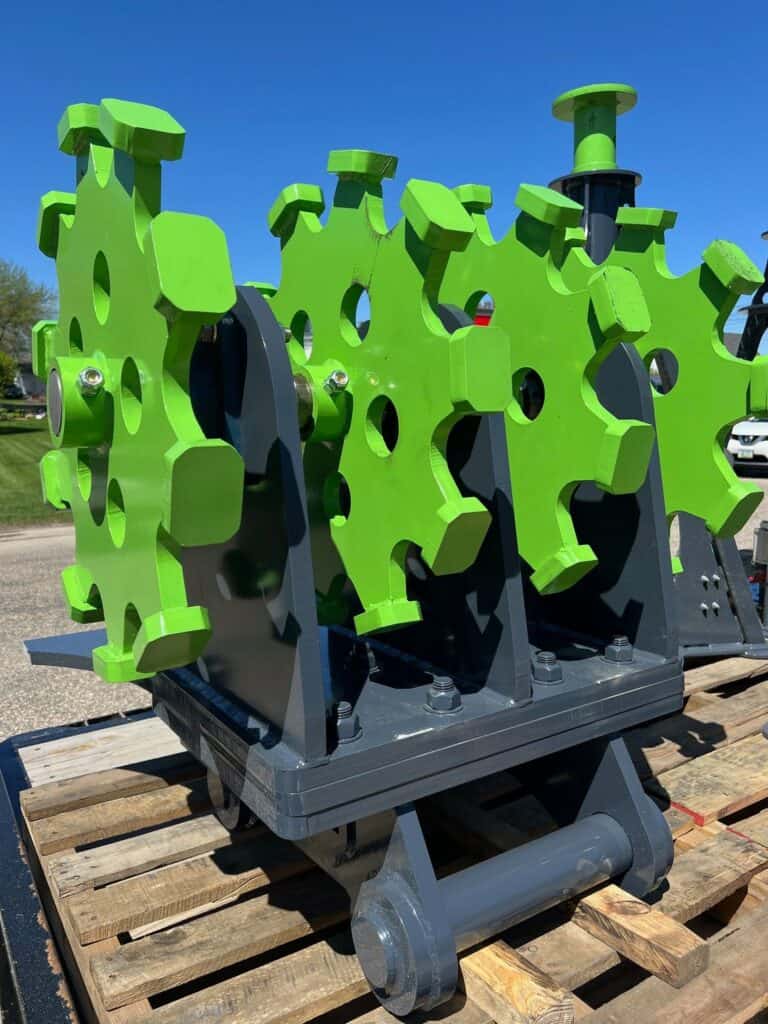 Excavator compaction wheel attachment for pipeline, drainage, and utility trench compaction