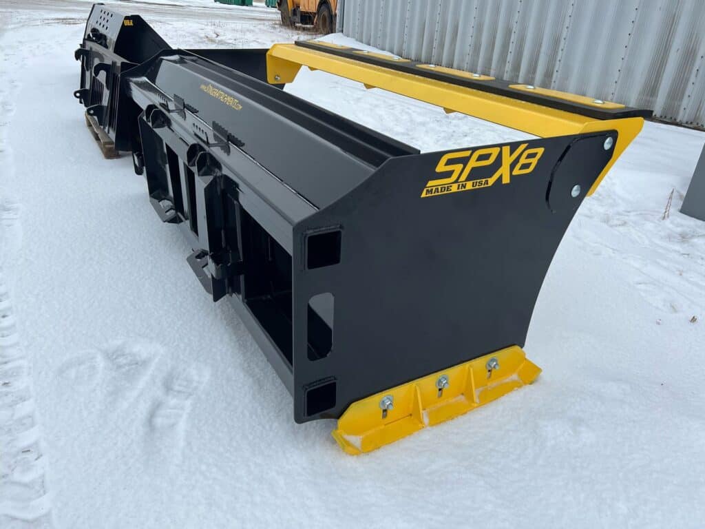 Stinger SPX skid steer snow pusher attachment for parking lot snow removal