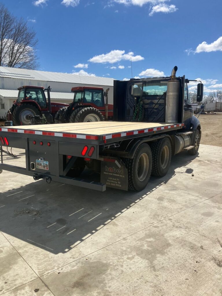 ECHO SS Super Skid removable flatbed installed on semi tractor converting truck into tandem tender truck