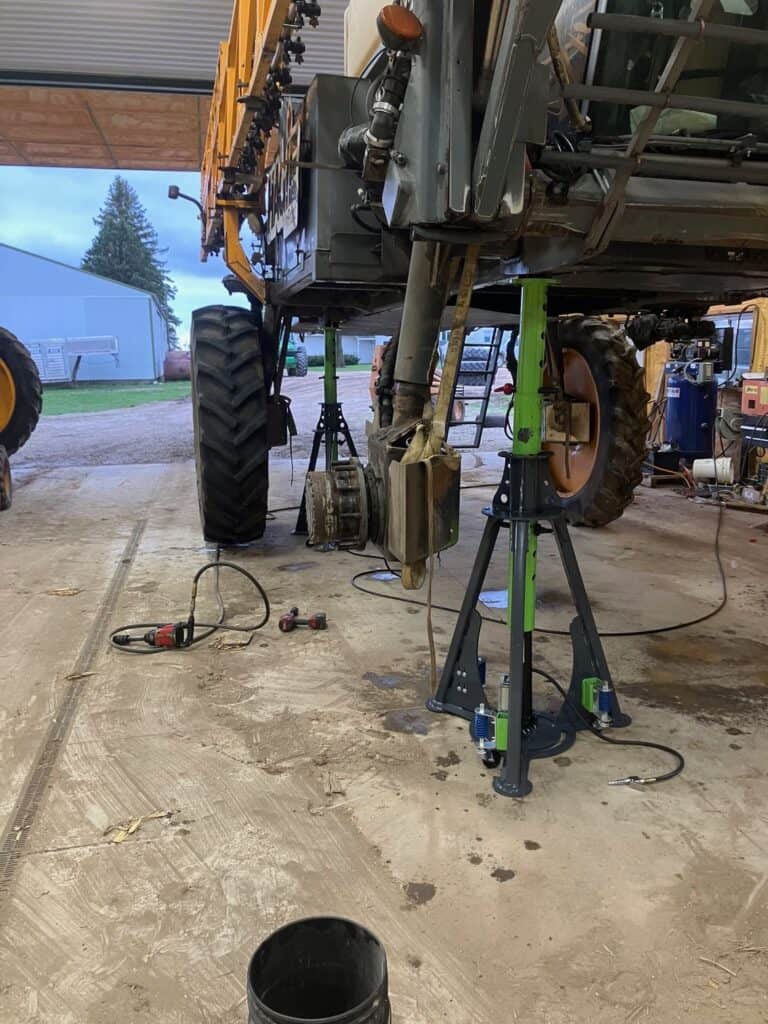 ECHO 20 ton pneumatic sprayer jack lifting high clearance agricultural sprayer during service