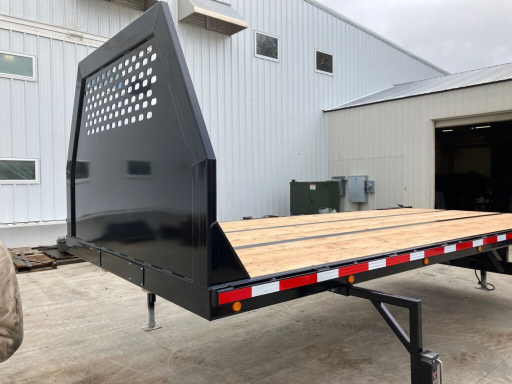 Removable semi flatbed skid system with rub rails and stake pockets