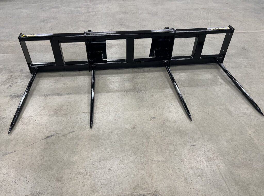 Stinger BS4 skid steer bale spear attachment for lifting and transporting round hay bales