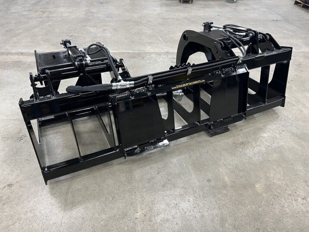 Stinger RTG tractor root grapple attachment with reinforced steel frame for brush and log handling