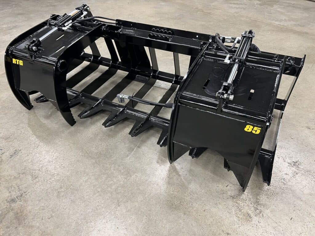 Stinger RTG tractor root grapple attachment for clearing brush, roots and debris on farms and properties