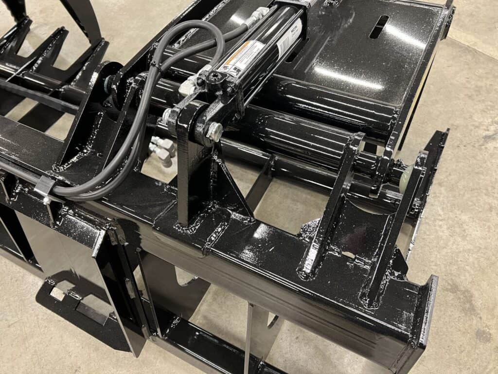 Close up of Stinger RTG tractor root grapple hydraulic system and heavy duty frame construction