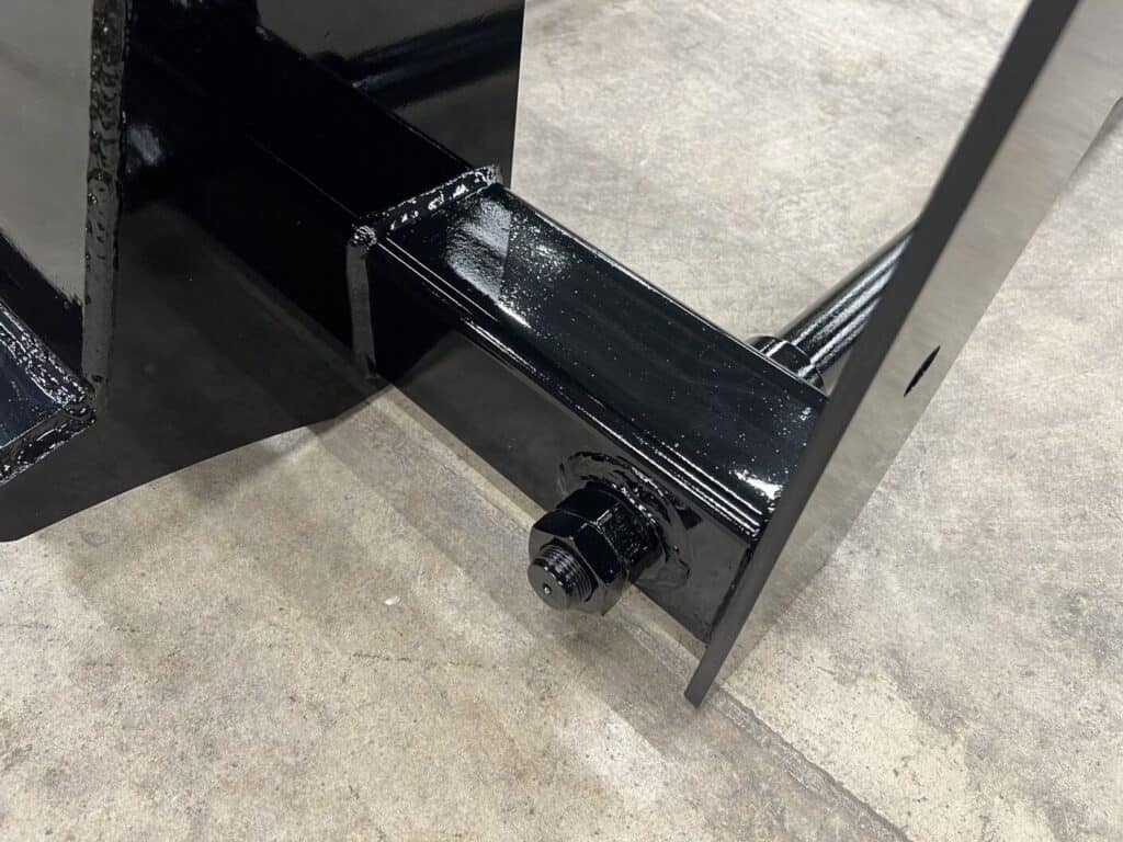 Stinger BS4 skid steer bale spear close up of spear connection showing bolt on design and reinforced mount