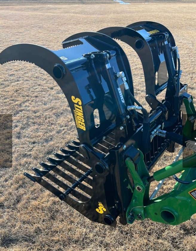 Stinger CROG compact tractor rock grapple attachment showing dual grapple arms and heavy steel frame
