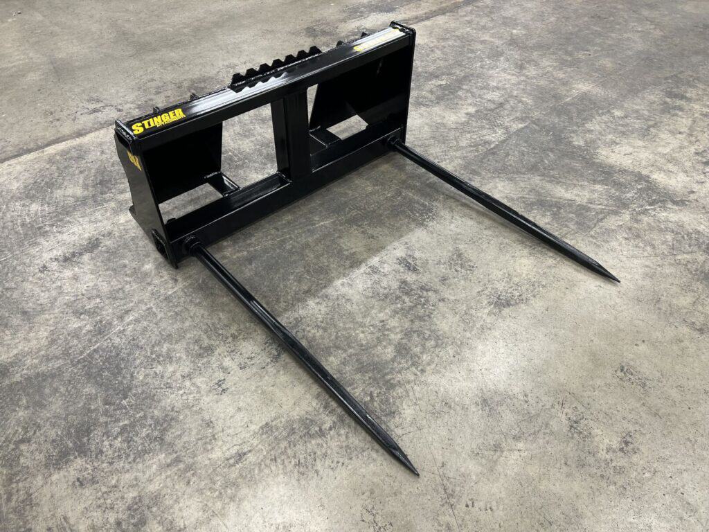 Front view Stinger BS2 skid steer bale spear attachment with quick attach mount and dual bale spears for round hay bales