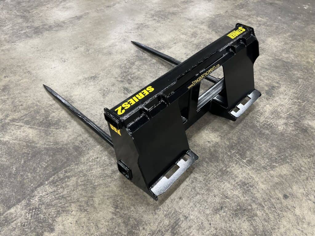 Stinger BS2 skid steer bale spear attachment with dual spears designed for handling round hay bales on farms and ranches
