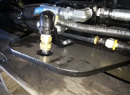 Hydraulic hose and fitting close up on M&M Hydra Clip 16 inch tree shear attachment