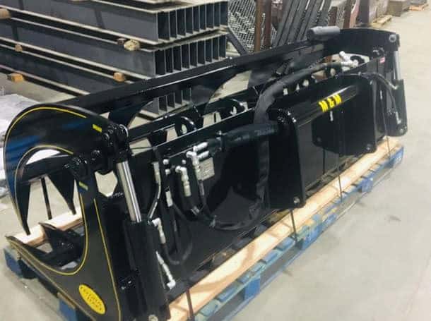 Rear left view of M&M Hydra Rake Extreme skid steer grapple rake attachment