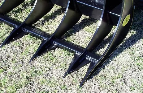Close up of heavy duty tines on M&M Hydra Rake Extreme skid steer rake