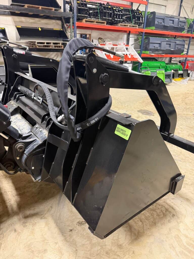 Prime Attachments high capacity skid steer grapple rear angle showing hydraulic hoses and reinforced steel frame