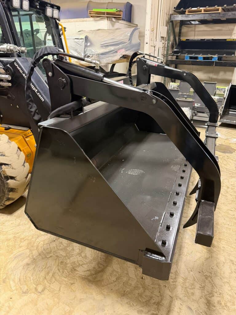 Prime Attachments high capacity skid steer grapple right side view mounted on skid steer for hay handling