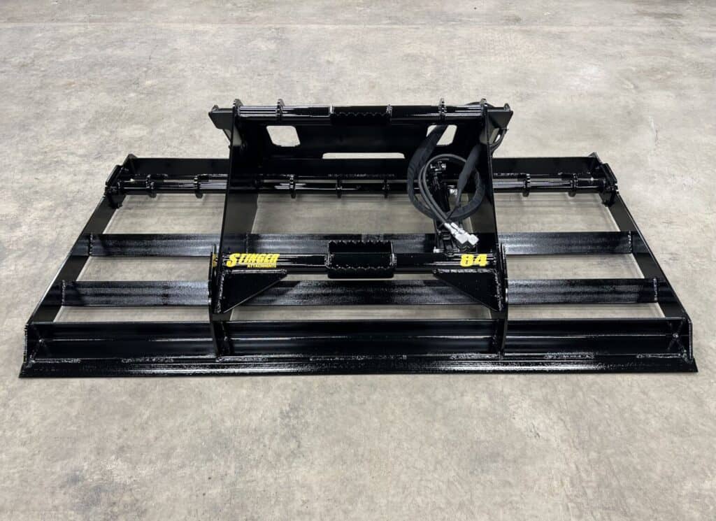 Stinger LP skid steer land plane left view showing dual blade setup and heavy duty construction