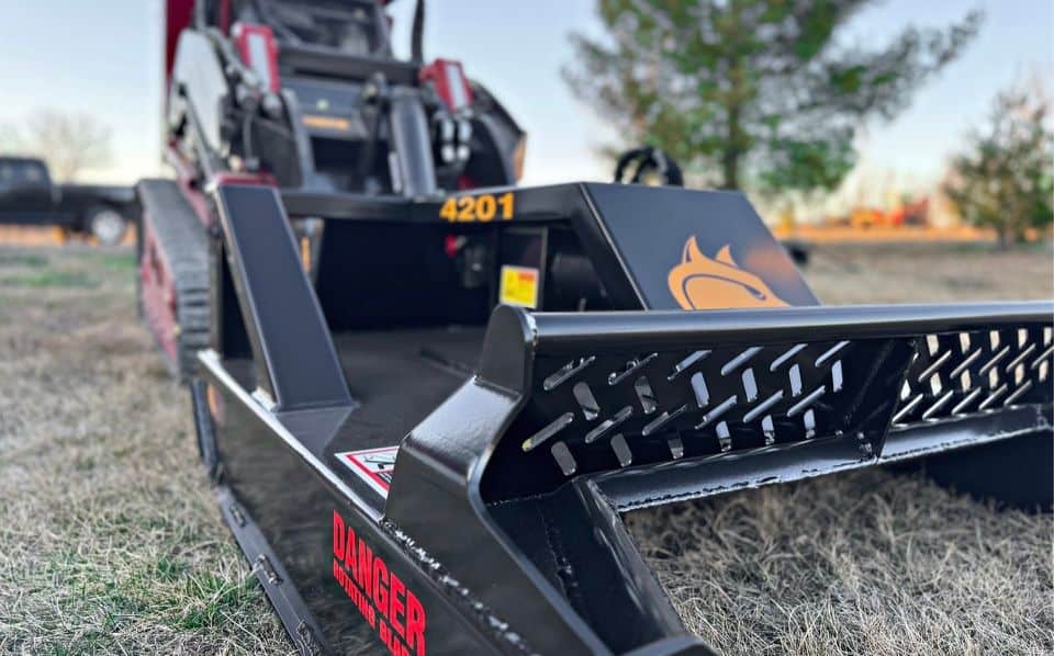 Brush Wolf open front mini skid steer brush cutter with heavy duty cutting deck