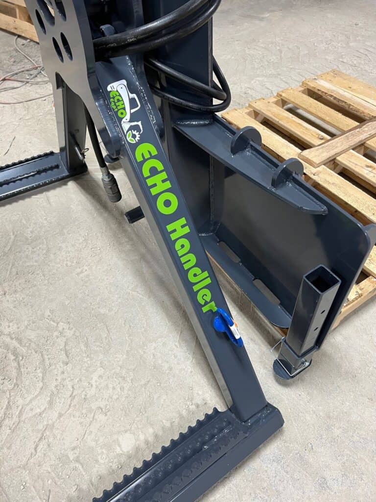 Close up hydraulic cylinder and frame structure on ECHO OG skid steer tire handler attachment