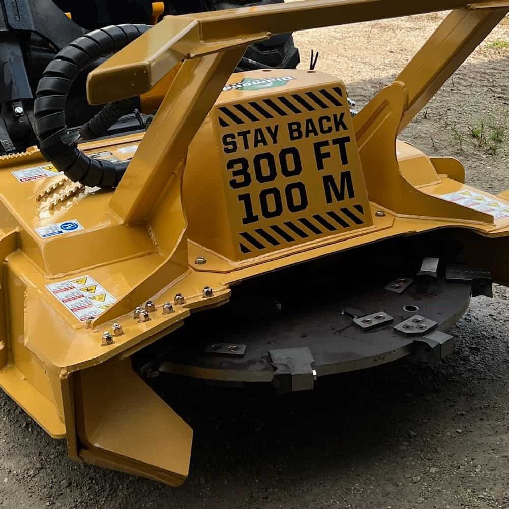 Diamond Mowers SK skid steer disc mulcher safety guard showing stay back warning for forestry mulching operations