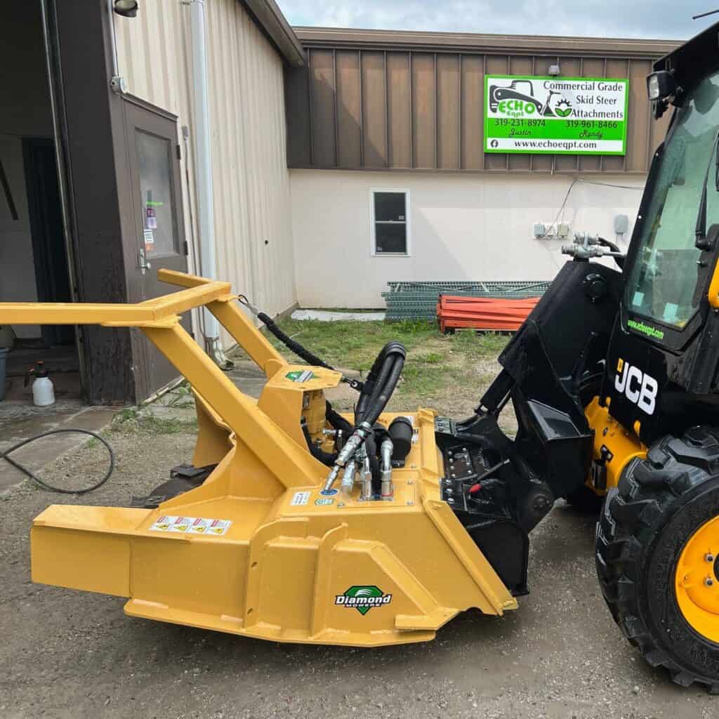 Diamond Mowers SK skid steer disc mulcher mounted on skid steer outside equipment dealership building