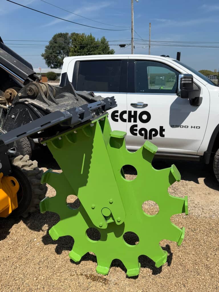 Side product view of the ECHO 48 inch skid steer compaction wheel showing the large diameter wheel and steel pads