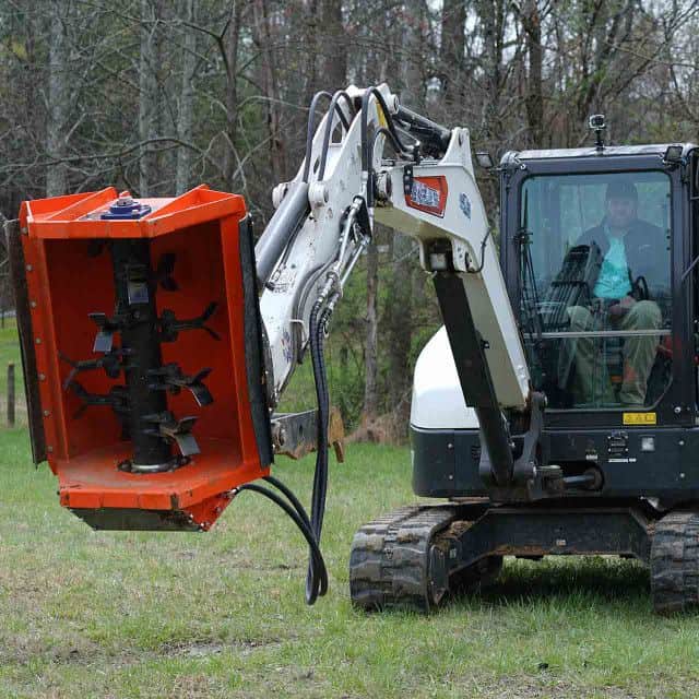 Eterra EX-30 excavator flail mower cutting in wooded area showing vegetation clearing and brush management