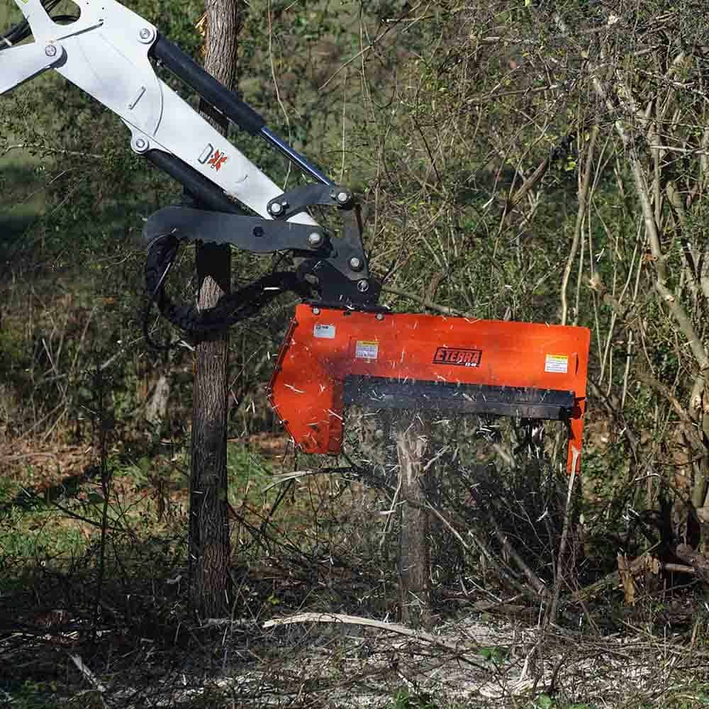Eterra EX-40 excavator flail mower rotor assembly with flail hammers cutting small trees and brush