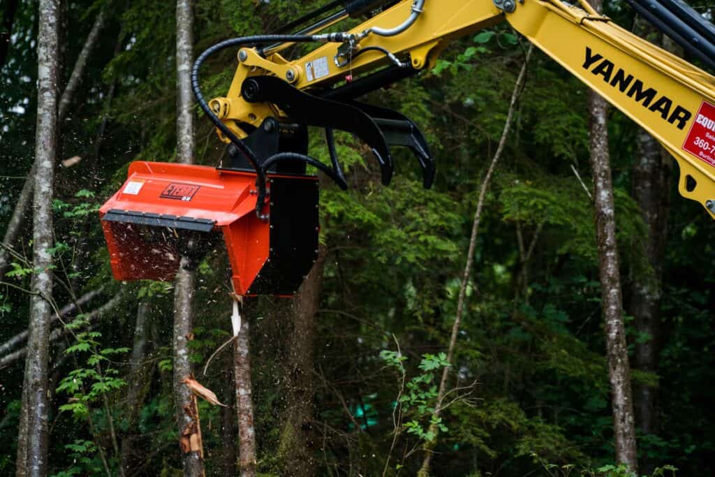 Eterra EX30 excavator forestry mulcher attachment cutting trees during land clearing