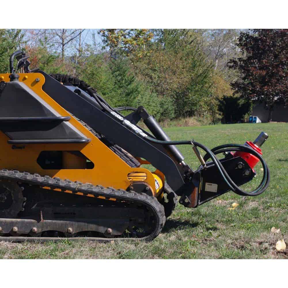 Eterra mini skid steer auger drive attachment mounted on mini skid for drilling holes in soil