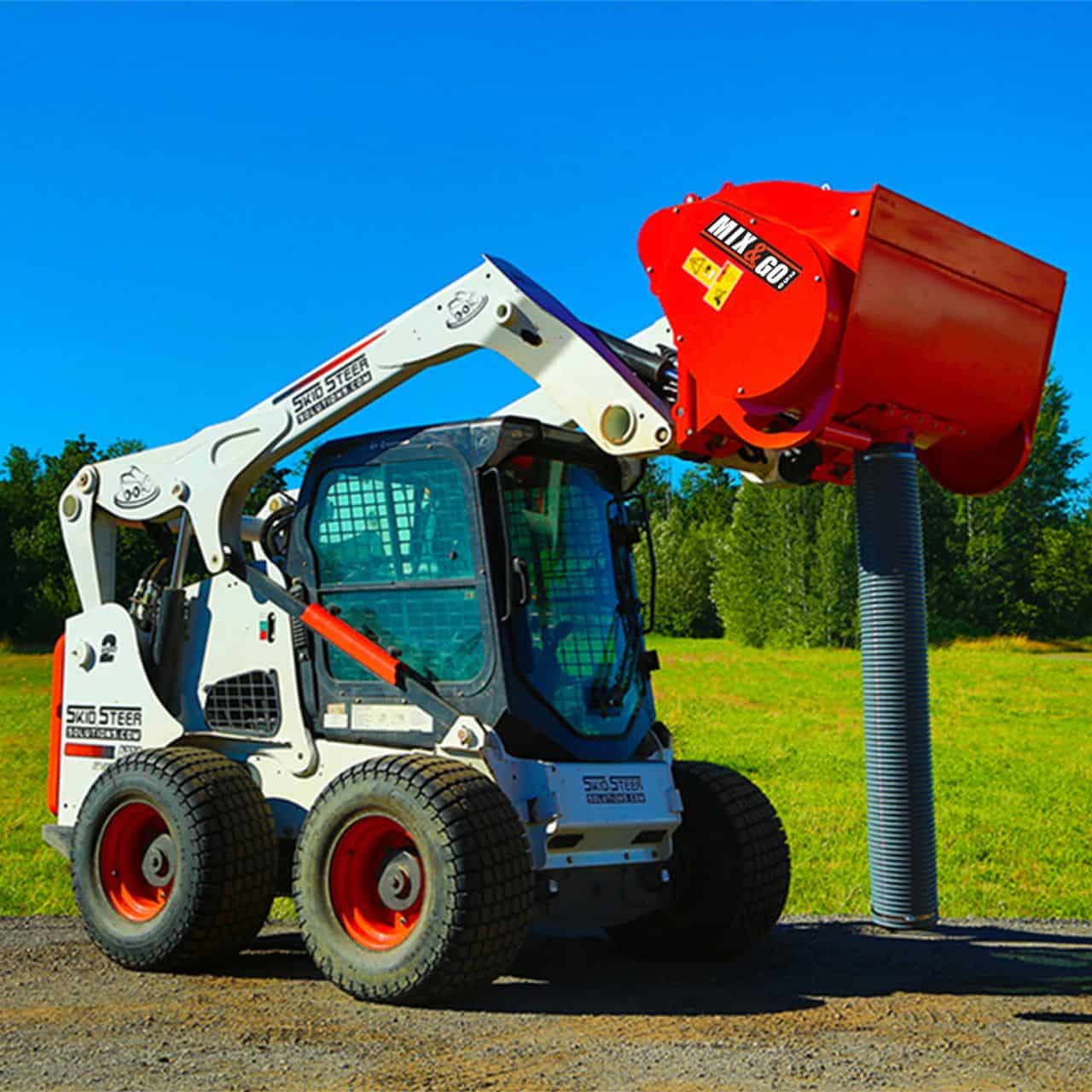 Eterra Hurricane skid steer concrete mixer attachment mounted on skid steer loader