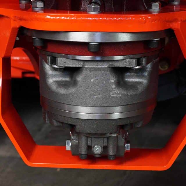 Eterra Vortex skid steer stump grinder motor close up showing high torque hydraulic drive system and heavy duty housing