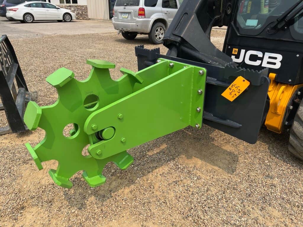 ECHO SSCW skid steer compaction wheel attachment mounted on JCB skid steer for trench soil compaction work
