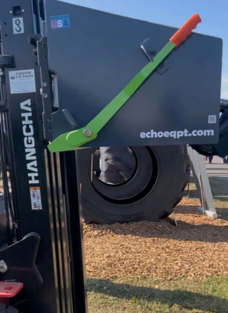 Close up latch handle and frame detail on ECHO X3FL forklift tire grabber attachment
