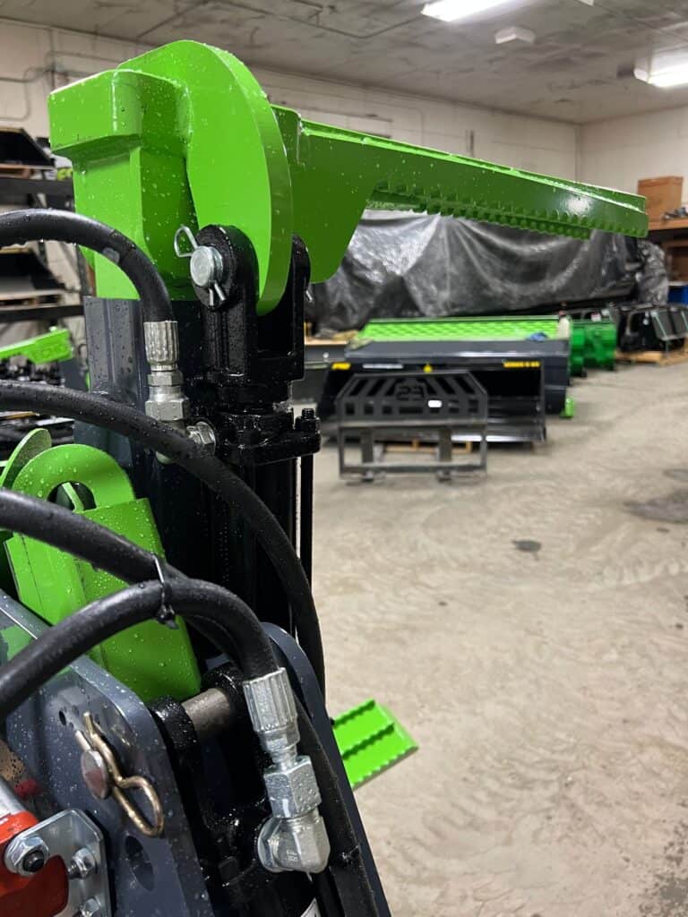 Close up hydraulic skid steer tire handler designed for lifting agricultural tractor tires